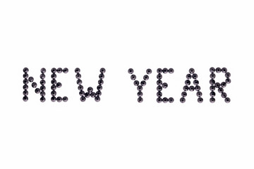Words NEW YEAR is made rhinestones black color on a white background.