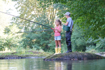 Happy kids fishing in river © goodluz