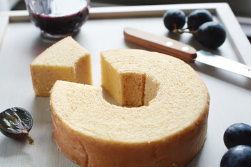 Close-up of traditional Japanese layered chiffon cake with hole in the middle. Soft focus. 