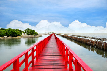 A long red bridge stretching at sea beautiful landscape