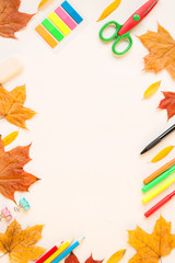 Stationery and Autumn leaves on the white background.