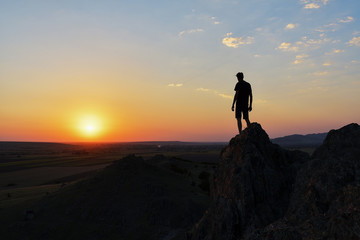 Fototapeta na wymiar Follow your dreams, silhouette of man at sunset
