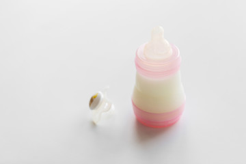 infant milk formula in baby bottle on table