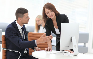 employees discussing business issues in office