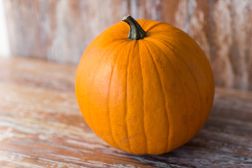 ripe pumpkin on wooden table