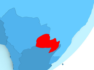 Fototapeta premium Map of Paraguay on blue political globe