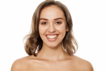 Foto op Canvas Portrait of beautiful young smiling woman on white background © vladimirfloyd