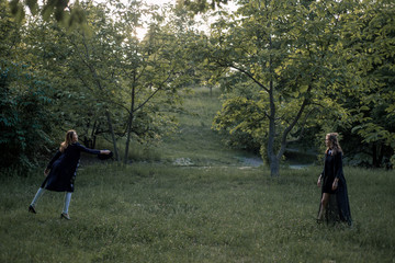 Mother and daughter catching hat