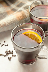 mulled wine in glass mugs on white background close-up.