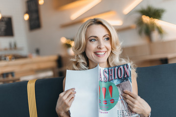 woman reading fashion magazine