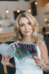 woman reading fashion magazine