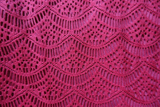 Cerise fabric with waves pattern from above