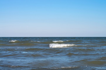 Fototapeta premium sea wave with white spray, horizon. Blue sky. Azov. Ukraine.