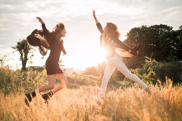 Mom with daughter  walking in the field
