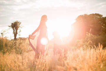 Mom with daughter  walking in the field