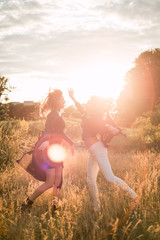 Mom with daughter  walking in the field