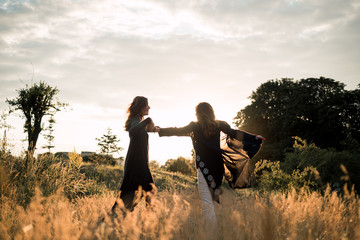 Mom with daughter  walking in the field