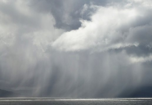 Heavy rain shower passing through between the Isle of Skye and Rum, Scotland © Alistair MacLean