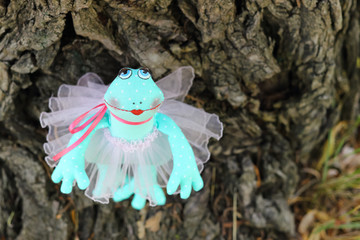 Soft textile art doll toy enamored girl frog-bride in wedding dress. Wedding concept