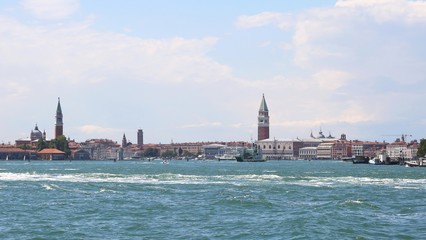 Fototapeta na wymiar The magnificent bell tower of San Marco and the bell tower of th