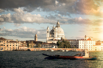 Fototapeta premium Basilica di Santa Maria della Salute, Background Venice in Italy with boats and church Salute, Venetian lagoon with Basilica di Santa Maria della Salute, Symbol of Venice vintage