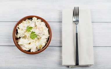 Typical dish of spain, russian salad with fork. Mediterranean diet.