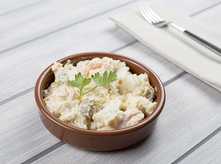Typical dish of spain, russian salad with fork. Mediterranean diet.