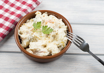 Typical dish of spain, russian salad with fork. Mediterranean diet.