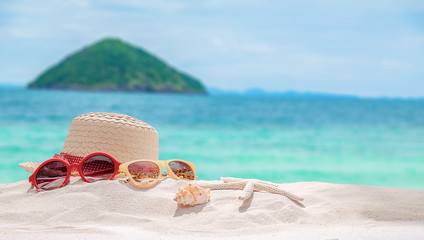 Fototapeta na wymiar Summer vacation concept with accessories on sandy beach