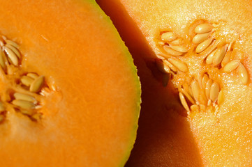 Cross-section of an orange-fleshed cantaloupe with seeds 