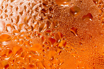 abstract background of drops on a red glass