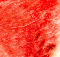 red ripe juicy watermelon in a cut as background