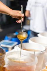 the beekeeper sells honey in the market