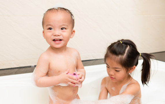 boy son and pretty happiness girl washing body