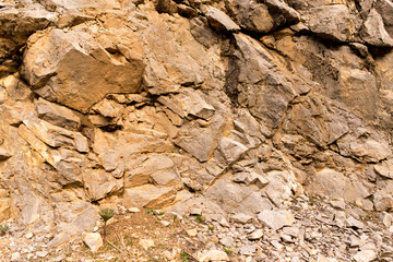 Stone cliffs in the mountains as a background