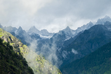 Naklejka na ściany i meble Snowy Himalayan Peaks seen from Kasol, India