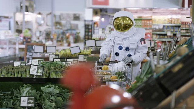  Off duty astronaut doing his grocery shopping at the supermarket