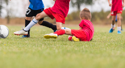Kids soccer football - children players match on soccer field