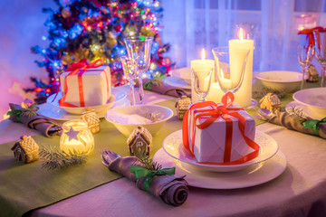 Moody Christmas table setting with present and tree