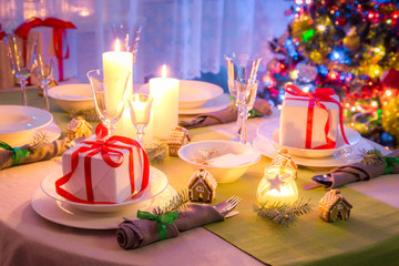 Traditionally Christmas table setting with green and white decoration