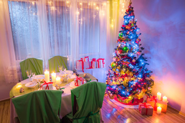 Beautiful Christmas table setting for Christmas eve in frosty evening