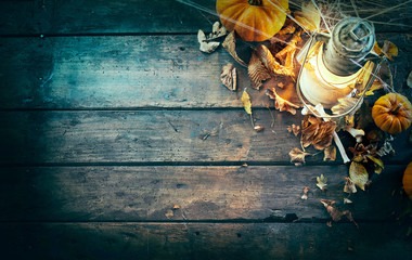 Halloween theme with pumpkins, bones, lamp