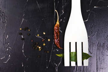 Pepper and wooden utensils