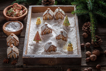 Beautiful gingerbread cottages for Christmas with snowman and trees