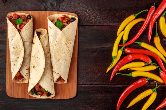 Mexican burritos with chili peppers and copyspace