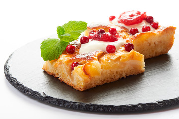 Apple cake with cream, jam and forest berries
