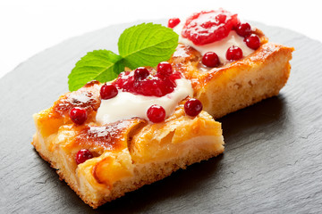 Apple cake with cream, jam and forest berries