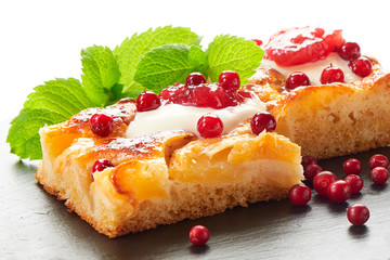 Apple cake with cream, jam and forest berries