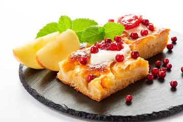 Apple cake with cream, jam and forest berries