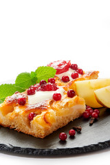 Apple cake with cream, jam and forest berries